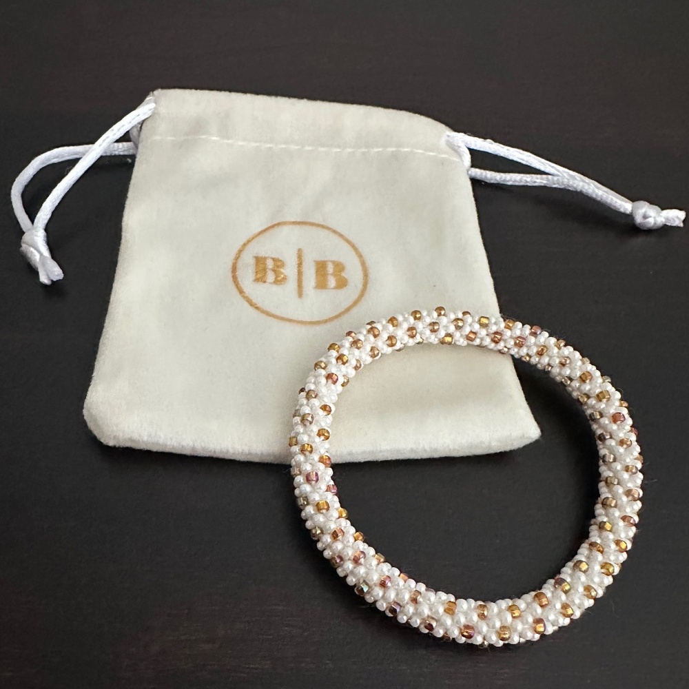 Aid Through Trade Roll-On® Bracelet NWOT White & Gold